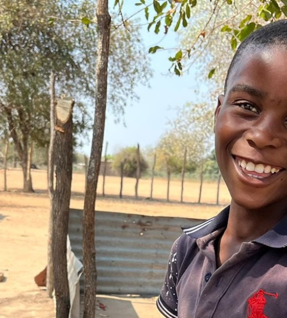 boy eating Mary's Meals in Mozambique