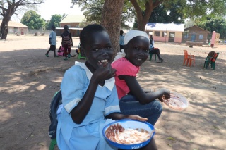 Girls eating Mary's Meals in South Sudan